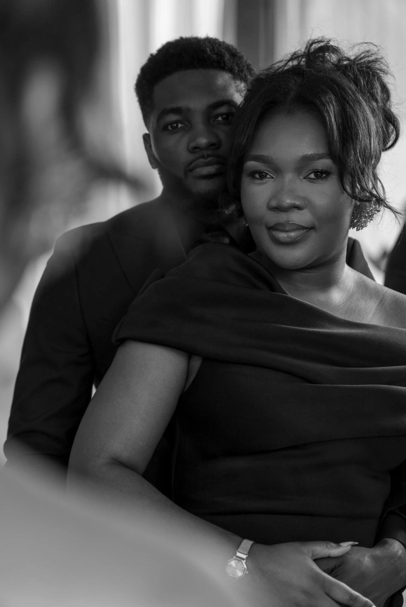 Couple embracing, black and white portrait